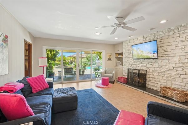 Fireplace, Interior, Living room, Recessed Lighting, Stone Walls, Wood Texture Flooring