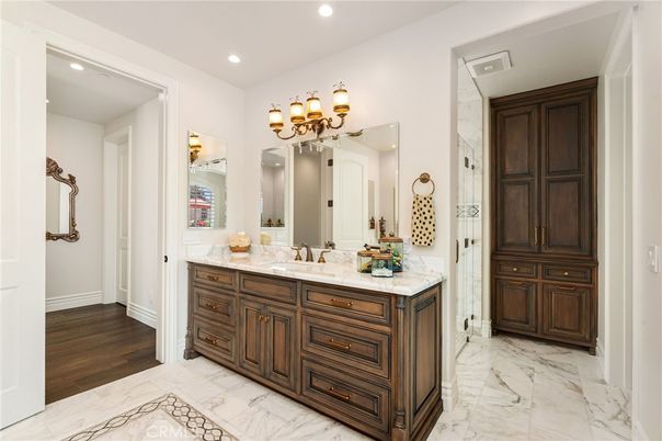 Bathroom, Dual Sink Vanities, Interior, Marble, Recessed Lighting, Wood Texture Flooring