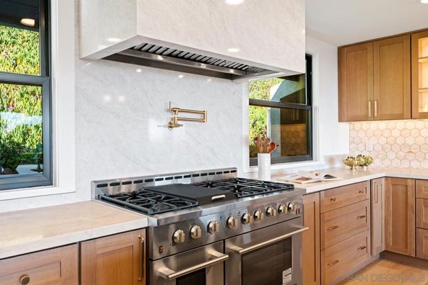 Interior, Kitchen, Marble Walls, Recessed Lighting, Stainless Steel Appliances, Wood Texture Flooring