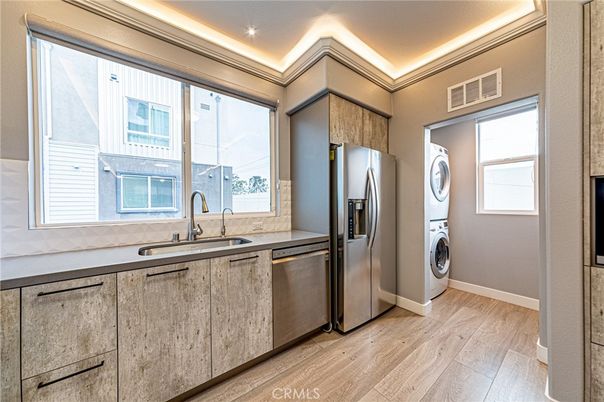 Interior, Kitchen, Recessed Lighting, Stainless Steel Appliances, Washer, Wood Texture Flooring