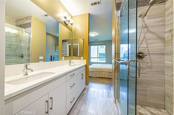 Bathroom, Bedroom, Dual Sink Vanities, Glass Shower, Interior, Wood Texture Flooring