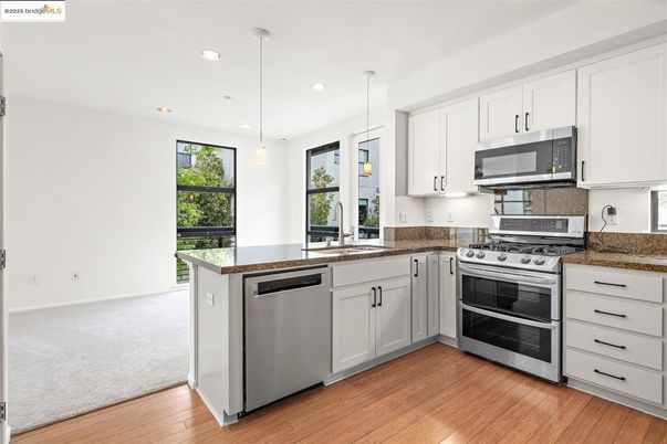 Interior, Kitchen, Pendant Lights, Recessed Lighting, Stainless Steel Appliances, Wood Texture Flooring