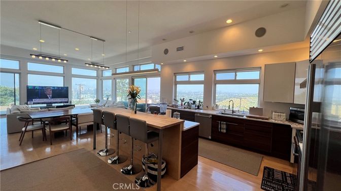 Dining room, Interior, Kitchen, Living room, Pendant Lights, Recessed Lighting, Stainless Steel Appliances, Water, Wood Texture Flooring