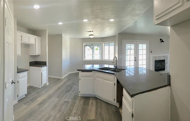 Fireplace, Interior, Kitchen, Recessed Lighting, Wood Texture Flooring