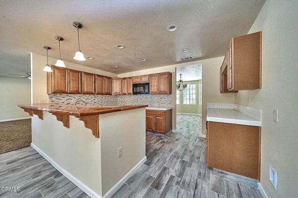 Interior, Kitchen, Pendant Lights, Recessed Lighting, Tile Countertops, Wood Texture Flooring