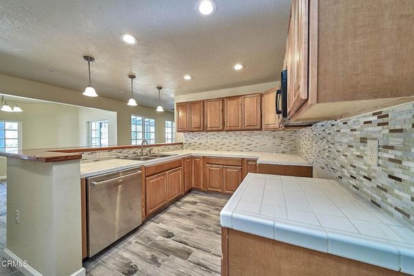 Interior, Kitchen, Pendant Lights, Recessed Lighting, Tile Countertops, Wood Texture Flooring