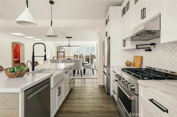Dining room, Interior, Kitchen, Pendant Lights, Recessed Lighting, Stainless Steel Appliances, Water, Wood Texture Flooring
