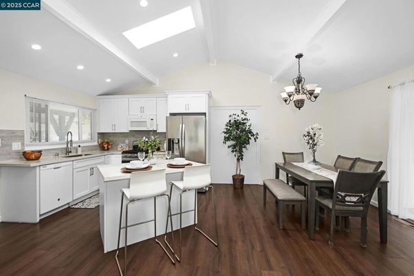 Chandelier, Dining room, Interior, Kitchen, Recessed Lighting, Stainless Steel Appliances, Wood Texture Flooring
