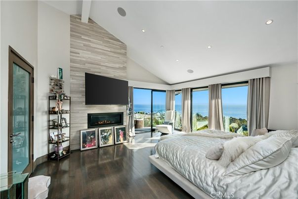 Bedroom, Fireplace, Interior, Recessed Lighting, Water, Wood Texture Flooring, Wooden Walls