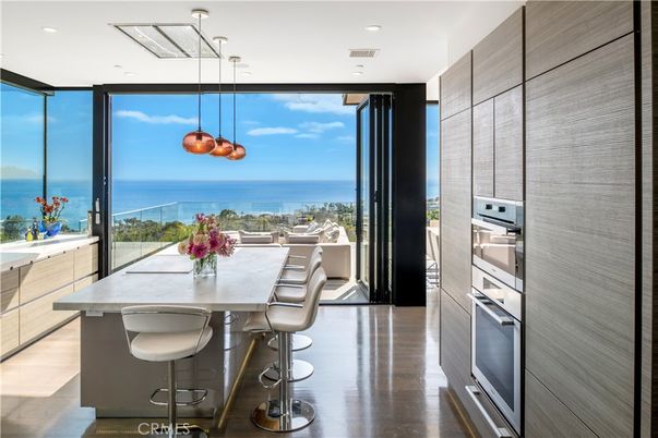 Dining room, Interior, Kitchen, Pendant Lights, Recessed Lighting, Stainless Steel Appliances, Water, Wood Texture Flooring