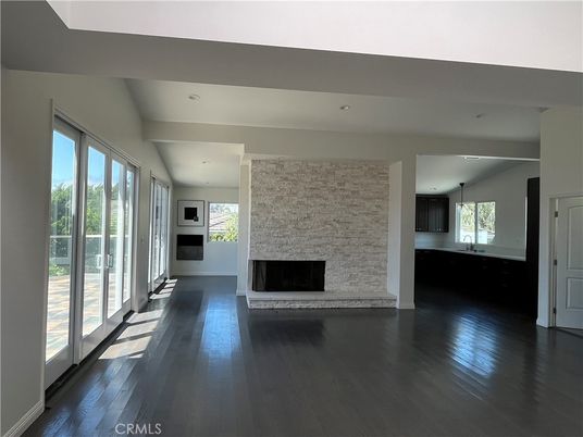 Empty room, Fireplace, Interior, Pendant Lights, Recessed Lighting, Stone Walls, Wood Texture Flooring