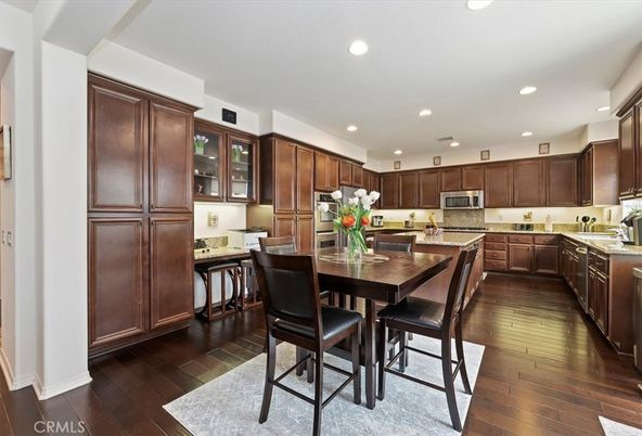 Dining room, Interior, Kitchen, Recessed Lighting, Stainless Steel Appliances, Wood Texture Flooring