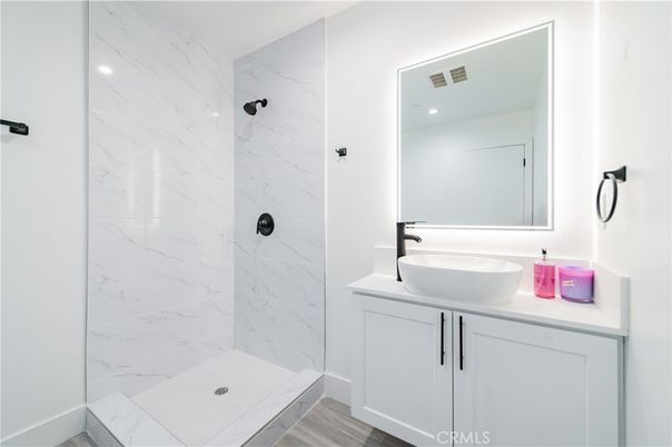 Bathroom, Glass Shower, Interior, Marble Walls, Recessed Lighting, Wood Texture Flooring