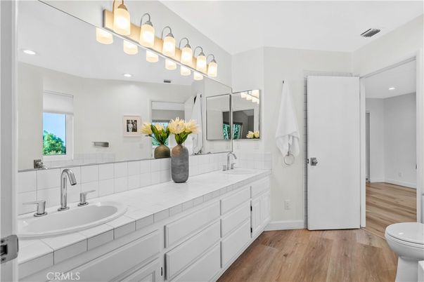 Bathroom, Dual Sink Vanities, Interior, Recessed Lighting, Tile Countertops, Wood Texture Flooring