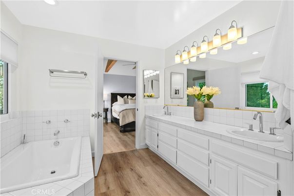 Bathroom, Bedroom, Dual Sink Vanities, Interior, Recessed Lighting, Tile Countertops, Wood Texture Flooring