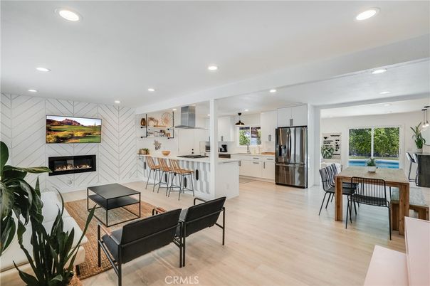 Dining room, Fireplace, Interior, Kitchen, Pendant Lights, Recessed Lighting, Stainless Steel Appliances, Wood Texture Flooring