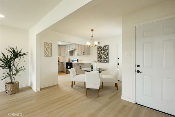 Chandelier, Dining room, Interior, Kitchen, Pendant Lights, Recessed Lighting, Stainless Steel Appliances, Wood Texture Flooring