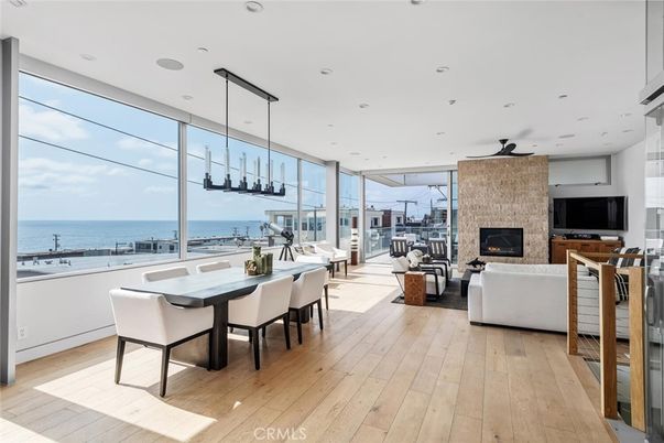 Dining room, Fireplace, Interior, Living room, Pendant Lights, Recessed Lighting, Water, Wood Texture Flooring