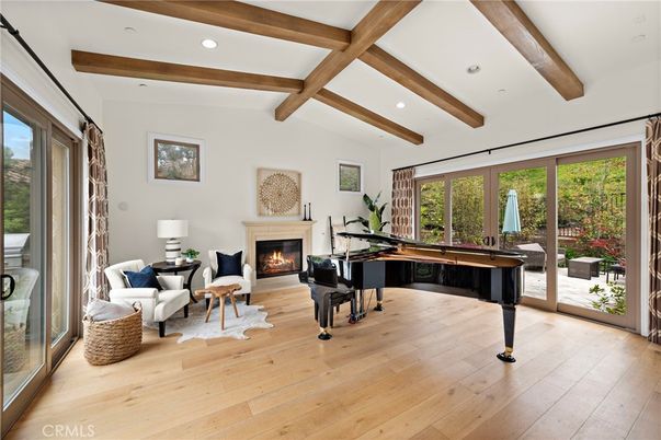 Billiard Table, Fireplace, Game Room, Interior, Living room, Piano, Recessed Lighting, Wooden Beams, Wood Texture Flooring