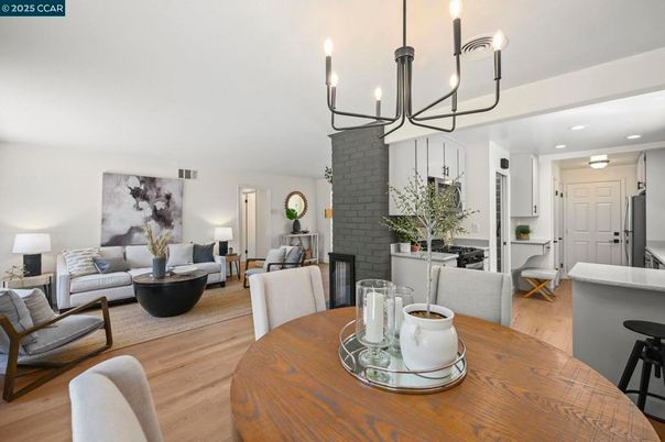 Chandelier, Dining room, Fireplace, Interior, Living room, Recessed Lighting, Stone Walls, Wood Texture Flooring
