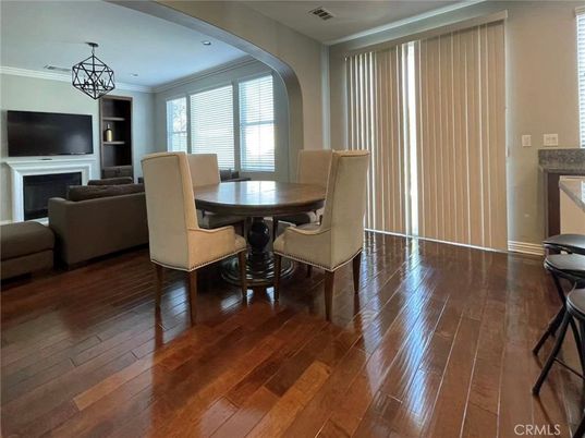 Dining room, Fireplace, Interior, Living room, Recessed Lighting, Wood Texture Flooring