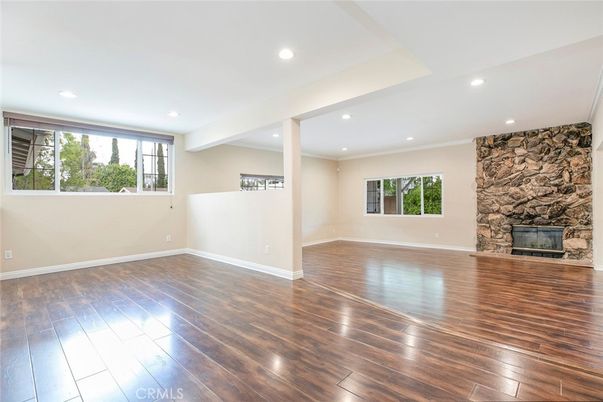 Empty room, Fireplace, Interior, Recessed Lighting, Stone Walls, Wood Texture Flooring