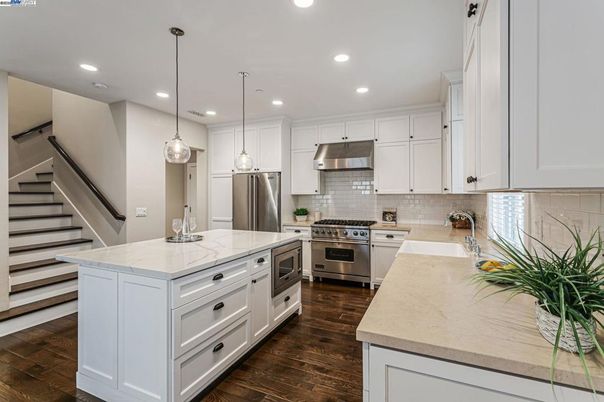 Interior, Kitchen, Pendant Lights, Recessed Lighting, Stainless Steel Appliances, Wood Texture Flooring
