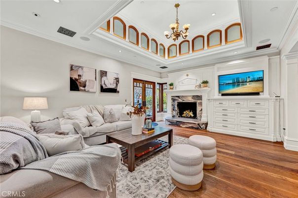 Chandelier, Fireplace, Interior, Living room, Recessed Lighting, Wood Texture Flooring