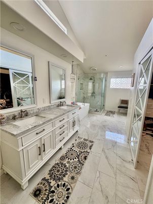 Bathroom, Dual Sink Vanities, Free Standing Baths, Glass Shower, Interior, Marble, Marble Walls, Recessed Lighting