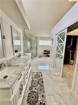 Bathroom, Dual Sink Vanities, Glass Shower, Interior, Marble, Marble Walls, Recessed Lighting