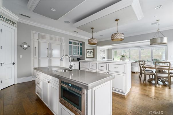 Dining room, Interior, Kitchen, Pendant Lights, Recessed Lighting, Stainless Steel Appliances, Wood Texture Flooring