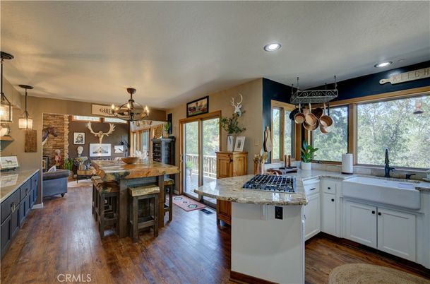 Chandelier, Dining room, Fireplace, Interior, Kitchen, Pendant Lights, Recessed Lighting, Wood Texture Flooring