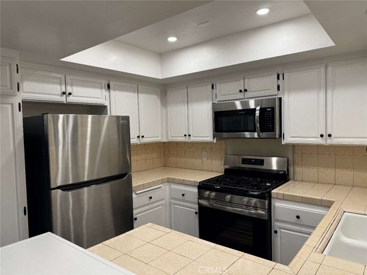 Interior, Kitchen, Recessed Lighting, Stainless Steel Appliances, Tile Countertops