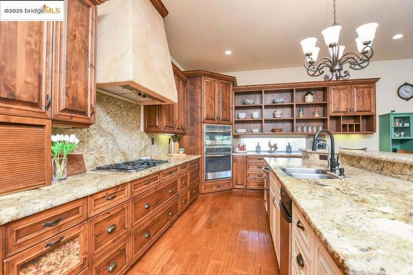 Chandelier, Interior, Kitchen, Recessed Lighting, Stainless Steel Appliances, Wood Texture Flooring