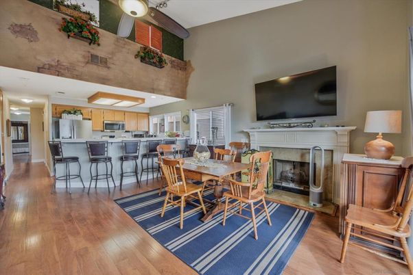 Dining room, Fireplace, Interior, Kitchen, Stainless Steel Appliances, Wood Texture Flooring