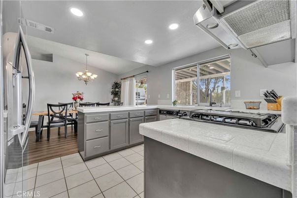 Chandelier, Dining room, Interior, Kitchen, Recessed Lighting, Tile Countertops, Wood Texture Flooring