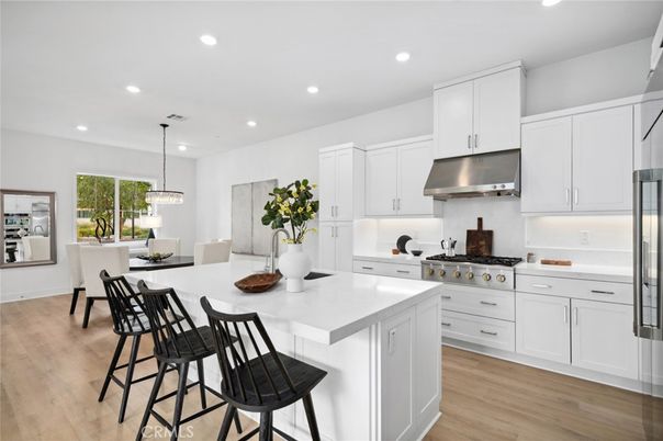 Dining room, Interior, Kitchen, Pendant Lights, Recessed Lighting, Stainless Steel Appliances, Wood Texture Flooring