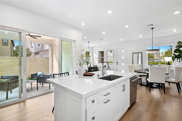 Dining room, Interior, Kitchen, Pendant Lights, Recessed Lighting, Stainless Steel Appliances, Wood Texture Flooring