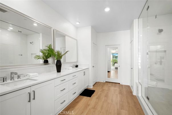 Bathroom, Dual Sink Vanities, Glass Shower, Interior, Recessed Lighting, Wood Texture Flooring
