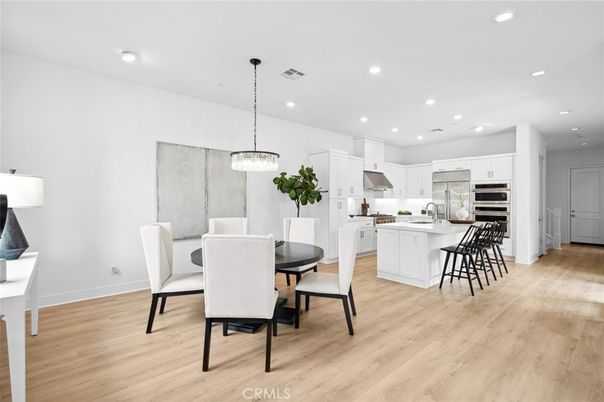 Chandelier, Dining room, Interior, Kitchen, Pendant Lights, Recessed Lighting, Stainless Steel Appliances, Wood Texture Flooring