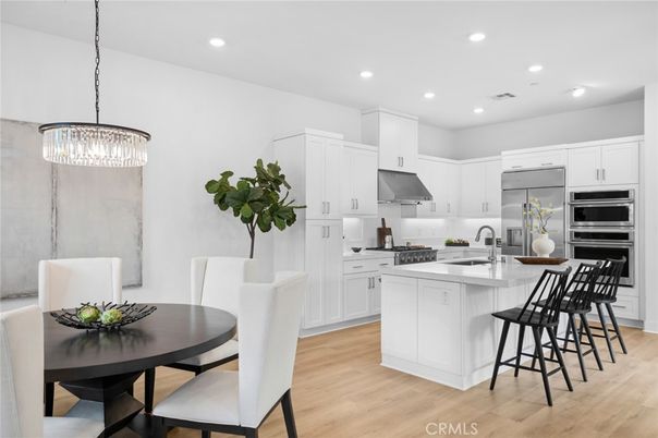 Chandelier, Dining room, Interior, Kitchen, Pendant Lights, Recessed Lighting, Stainless Steel Appliances, Wood Texture Flooring