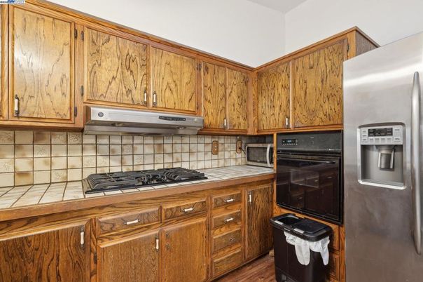 Interior, Kitchen, Tile Countertops, Wood Texture Flooring