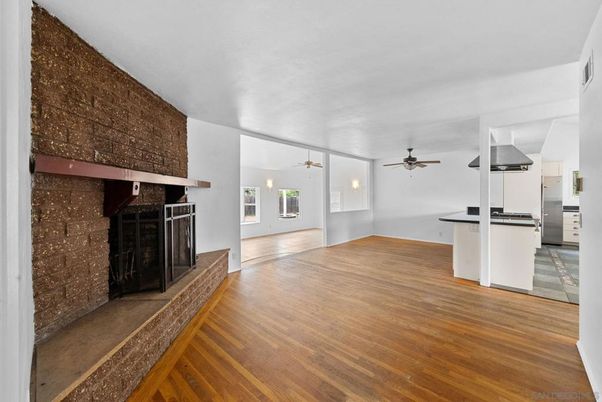 Empty room, Fireplace, Interior, Kitchen, Pendant Lights, Wood Texture Flooring