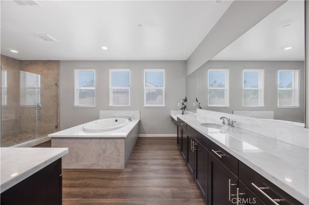 Bathroom, Dual Sink Vanities, Glass Shower, Interior, Recessed Lighting, Wood Texture Flooring