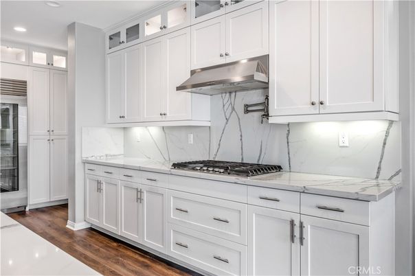 Interior, Kitchen, Marble Walls, Recessed Lighting, Stainless Steel Appliances, Wood Texture Flooring