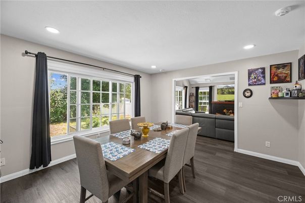 Dining room, Fireplace, Interior, Living room, Recessed Lighting, Wood Texture Flooring