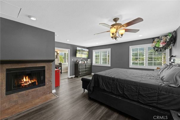 Bedroom, Fireplace, Interior, Recessed Lighting, Wood Texture Flooring