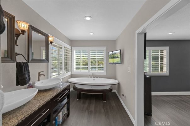 Bathroom, Dual Sink Vanities, Interior, Recessed Lighting, Wood Texture Flooring