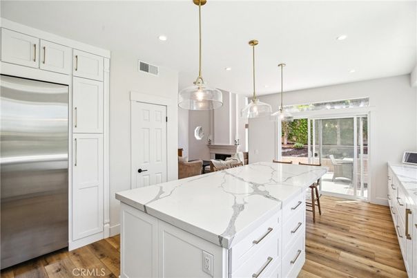 Dining room, Interior, Kitchen, Pendant Lights, Recessed Lighting, Stainless Steel Appliances, Wood Texture Flooring