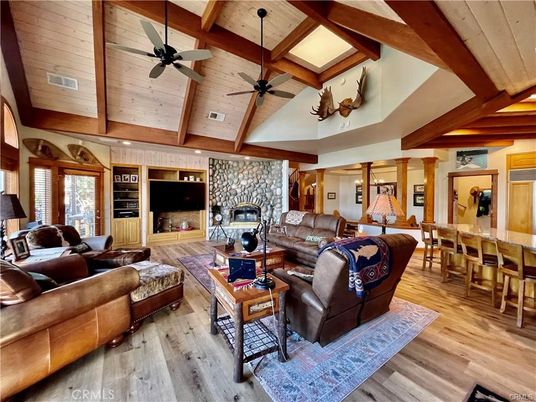 Dining room, Fireplace, Interior, Living room, Recessed Lighting, Stone Walls, Wooden Beams, Wooden Ceilings, Wood Texture Flooring